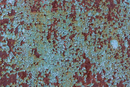 Blue cracked painting on metal surface