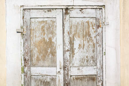 Close up of old wooden door with cracked paintの写真素材