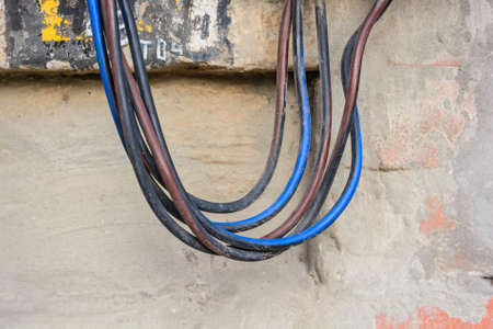 Close up electrical cords from electrical panelの写真素材