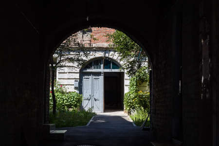 Back yard of house view from archwayの写真素材