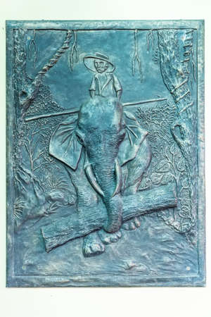 Close up vintage etchings embossed on metal wall