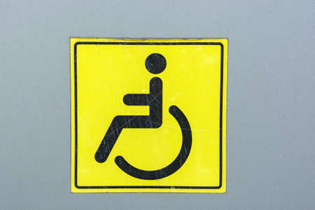 Close up disabled sign on a wallの写真素材