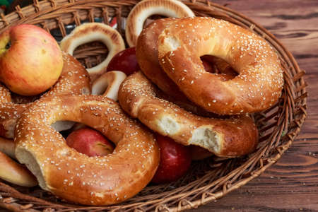 Close up of cut bagels with sesame seed and applesの写真素材