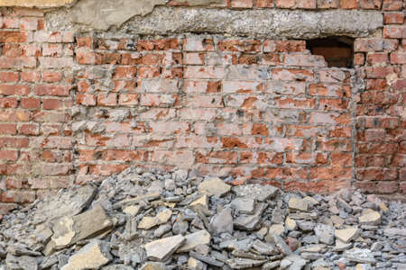 Old broken red brick wall