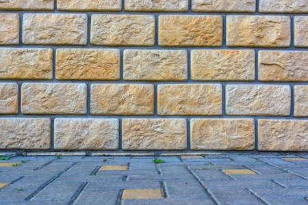 Beige brick wall background textureの写真素材