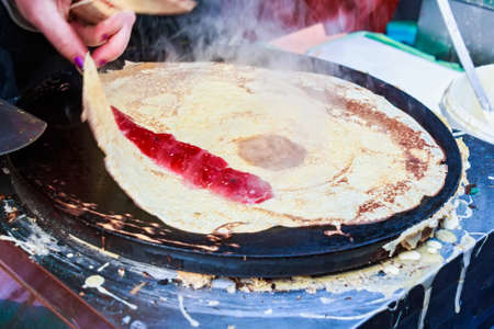 Cooking pancake outdoorsの写真素材
