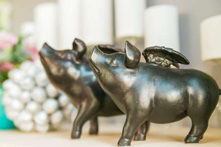 Metal decorative figurettes of pigs with wingsの写真素材