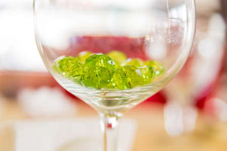 Close up green decorative crystals in glass