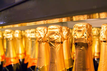 Close up champagne bottles in supermarketの写真素材