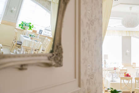Reflection of white interior of modern restaurantの写真素材
