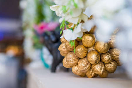 Decorative walnuts in shape of bunch of flowersの写真素材