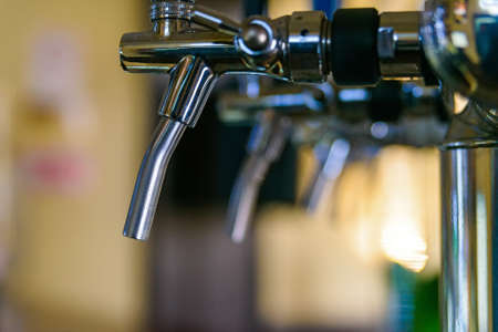 Close up of beer pipes on bar counterの写真素材