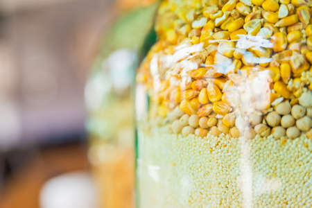 Decorative glass jar with grains
