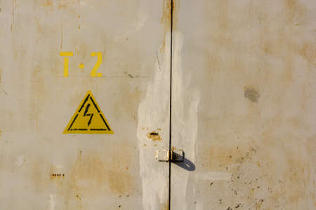 High voltage sign on grey wallの写真素材