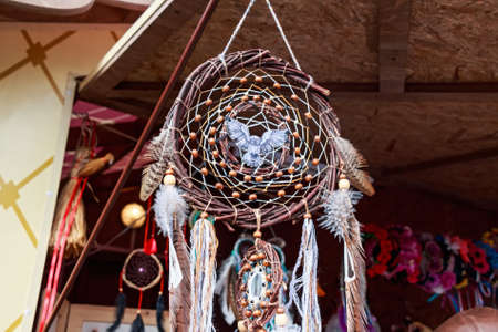 Crafted dream catcher souvenir with owl in centerの写真素材