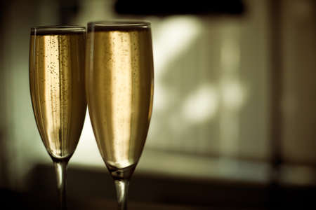 Two glasses of champagne with blurred backgroundの写真素材
