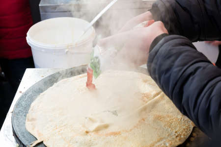 Cooking pancake outdoorsの写真素材