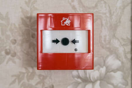 Close up of fire alarm switch in red box on wallの写真素材