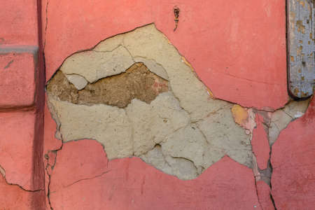 Cracked red cement plaster textureの写真素材