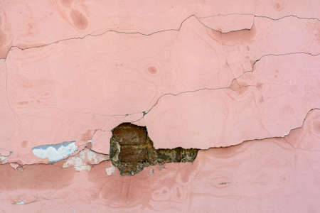 Cracked pink cement plaster textureの写真素材