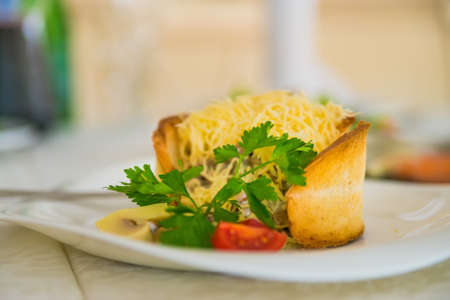 Warm salad with cheese in breadの写真素材