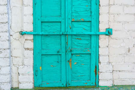 Old green wooden shutters closedの写真素材