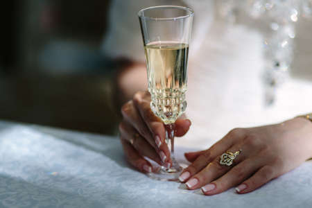 Bride holds glass of champagneの写真素材