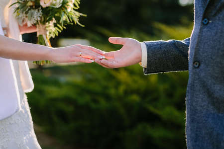 Close up bride and groom hold handsの写真素材