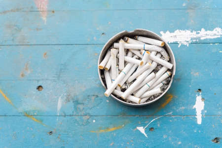 Cigarette in ash trayの写真素材