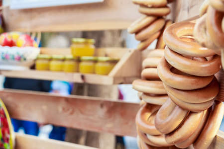 Bagels hang on rope at Russian fairの写真素材