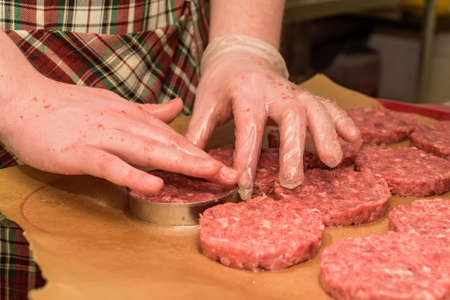 Hands kooking burger cutlets close upの写真素材