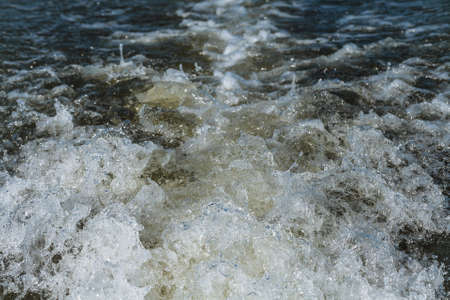 Trace tail of speed boat on water surfaceの写真素材