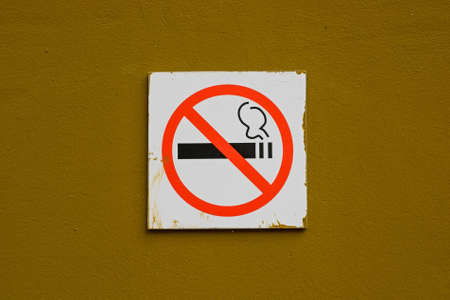 No smoking sign on brown wallの写真素材