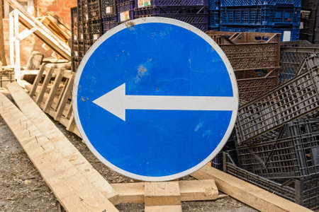 Blue arrow traffic sign turn leftの写真素材