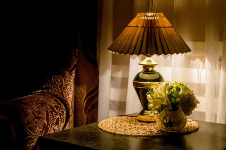 Cozy bedroom interior with bedside lampの写真素材