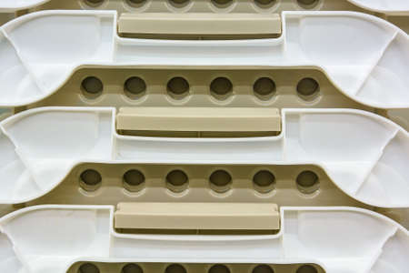 White plastic boxes stacked one upon the otherの写真素材