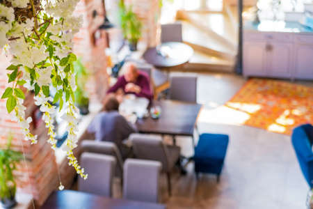Blurred top view people having lunch in restaurantの写真素材