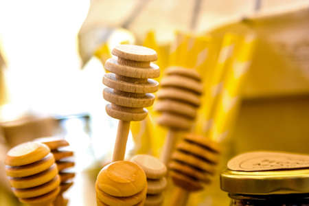 Several wooden honey sticksの写真素材