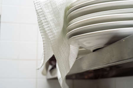 Stack of clean white ceramics platesの写真素材