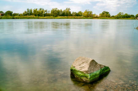 Beautiful river landscape with stone in summerの写真素材