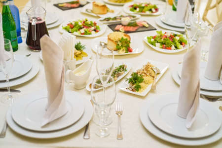 Served restaurant table with saladsの写真素材