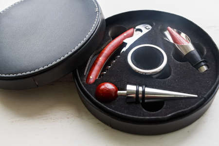 Set of metallic bar tools in a round boxの写真素材