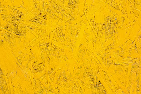 Close up bright yellow particle board surface