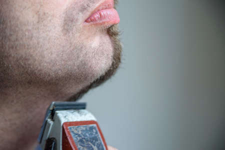 Close up side view half shaved beardの写真素材