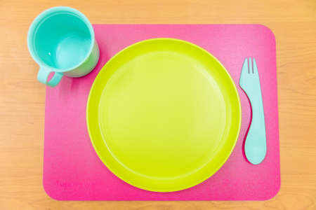 Bright plastic tablewareの写真素材