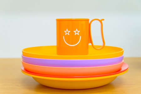Bright plastic tablewareの写真素材