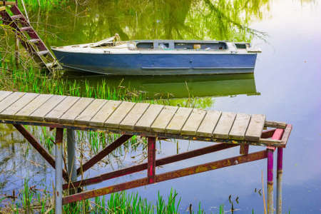 Boat moored on the river in summerの写真素材