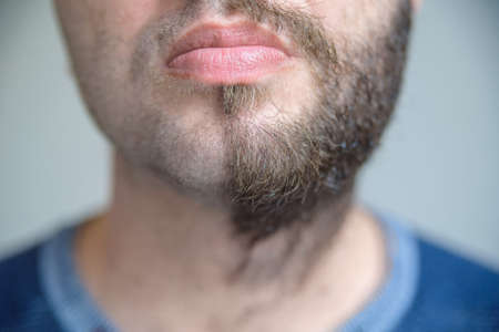 Close up half shaved beardの写真素材