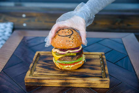 Preparing delicious hamburgerの写真素材