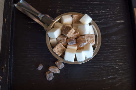 Lumps of white and brown sugar in restaurantの写真素材
